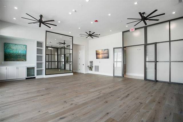 4162 Grande Brick Loop Unit 27, Orlando, FL 32837 - unfurnished living room with wood finished floors, recessed lighting, a ceiling fan, and wine cooler