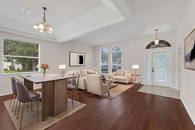 2534 Double Tree Pl, Oviedo, FL 32766 - dining area featuring a chandelier, hardwood / wood-style flooring, and vaulted ceiling
