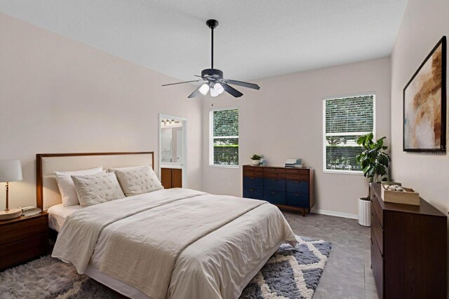 2534 Double Tree Pl, Oviedo, FL 32766 - bedroom featuring multiple windows, ceiling fan, and ensuite bath