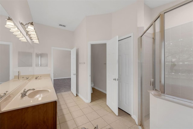 2534 Double Tree Pl, Oviedo, FL 32766 - full bathroom featuring a shower stall, double vanity, and tile patterned flooring