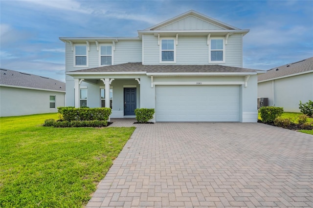 3840 Fescue St, Clermont, FL 34714 - view of front of home with decorative driveway, a front lawn, an attached garage, a porch, and roof with shingles