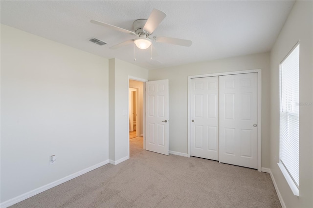 3840 Fescue St, Clermont, FL 34714 - unfurnished bedroom featuring carpet floors, a closet, and ceiling fan