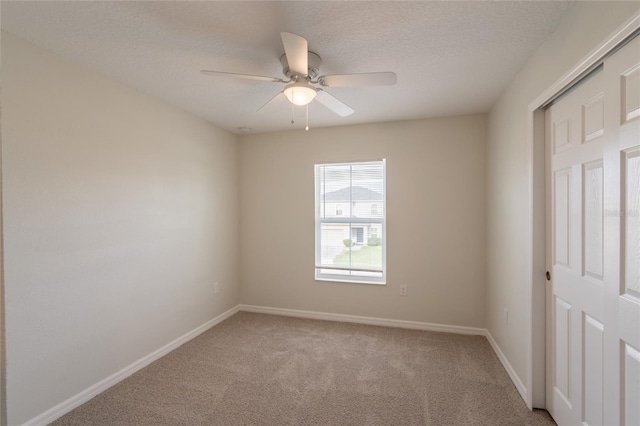 3840 Fescue St, Clermont, FL 34714 - unfurnished room with light carpet, ceiling fan, and a textured ceiling