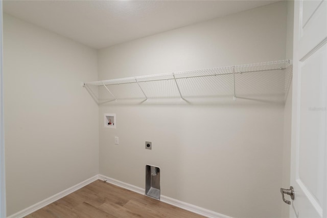 3840 Fescue St, Clermont, FL 34714 - laundry room featuring hookup for a washing machine, hookup for an electric dryer, and light wood finished floors