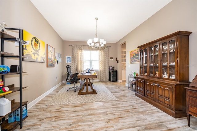 3546 Mediterra Dr, Clermont, FL 34711 - dining room featuring light wood-style flooring, a chandelier, and a desk