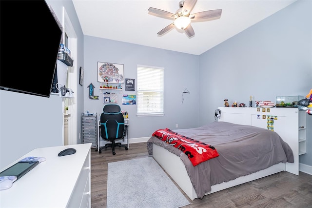 3546 Mediterra Dr, Clermont, FL 34711 - bedroom with wood finished floors, a desk, and ceiling fan