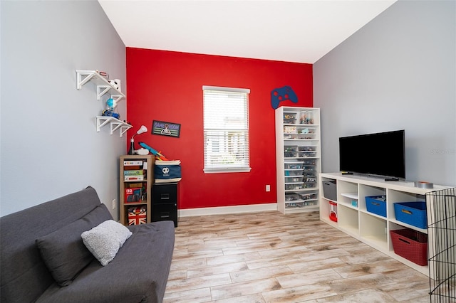 3546 Mediterra Dr, Clermont, FL 34711 - living room featuring wood finished floors and an accent wall