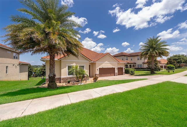 3546 Mediterra Dr, Clermont, FL 34711 - mediterranean / spanish-style home featuring an attached garage, a front lawn, a tile roof, concrete driveway, and stucco siding