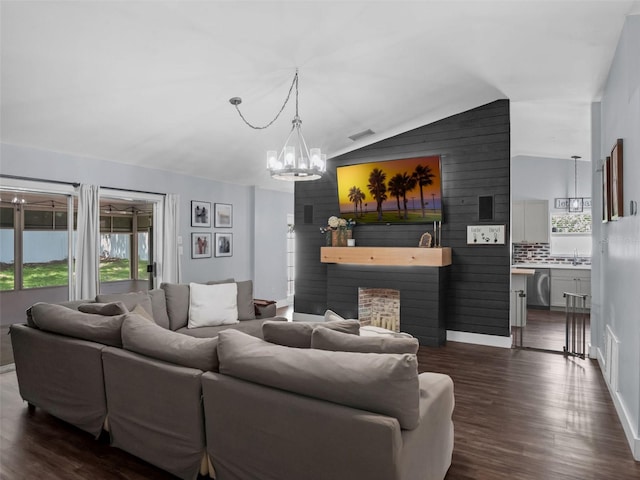 15718 Carriage Hill Ct, Clermont, FL 34711 - living area with lofted ceiling, a chandelier, and dark wood-style floors