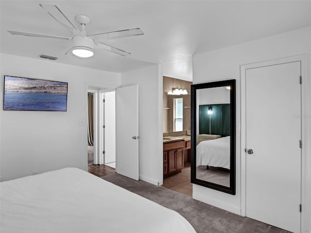 15718 Carriage Hill Ct, Clermont, FL 34711 - carpeted bedroom featuring ensuite bath and ceiling fan