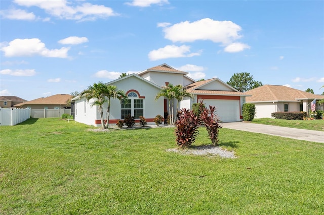 11341 Autumn Wind Loop, Clermont, FL 34711 - view of front of home with concrete driveway, an attached garage, and stucco siding