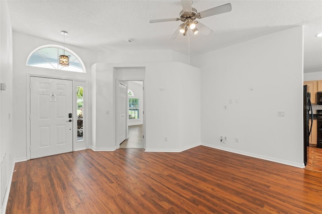 11341 Autumn Wind Loop, Clermont, FL 34711 - foyer featuring wood finished floors, a textured ceiling, and ceiling fan