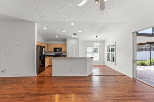 11341 Autumn Wind Loop, Clermont, FL 34711 - kitchen with black appliances, a textured ceiling, dark countertops, wood finished floors, and a chandelier