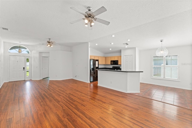 11341 Autumn Wind Loop, Clermont, FL 34711 - unfurnished living room featuring a textured ceiling, ceiling fan, wood finished floors, a chandelier, and recessed lighting