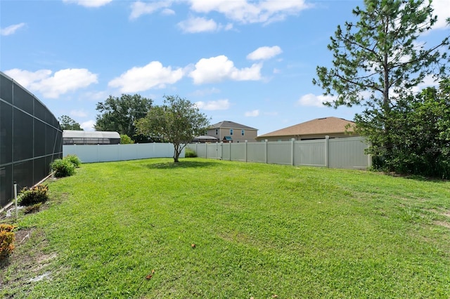 11341 Autumn Wind Loop, Clermont, FL 34711 - fenced backyard with glass enclosure