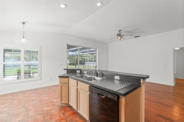 11341 Autumn Wind Loop, Clermont, FL 34711 - kitchen with dishwasher, dark countertops, a ceiling fan, a textured ceiling, and a center island with sink