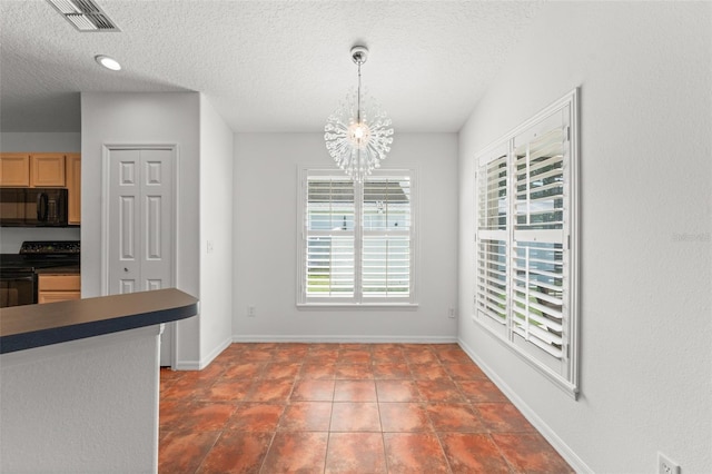 11341 Autumn Wind Loop, Clermont, FL 34711 - unfurnished dining area featuring a chandelier, a textured ceiling, and tile patterned flooring