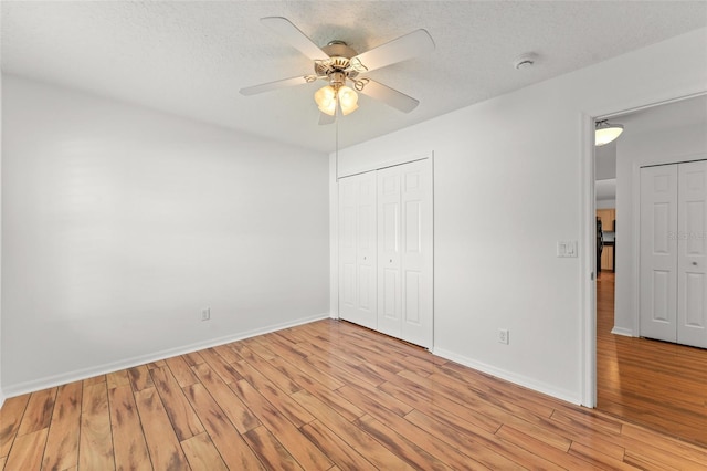 11341 Autumn Wind Loop, Clermont, FL 34711 - unfurnished bedroom featuring light wood-type flooring, a closet, and a ceiling fan