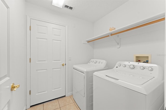 11341 Autumn Wind Loop, Clermont, FL 34711 - laundry room featuring washing machine and clothes dryer and light tile patterned floors