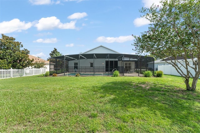 11341 Autumn Wind Loop, Clermont, FL 34711 - rear view of house with a fenced backyard and glass enclosure