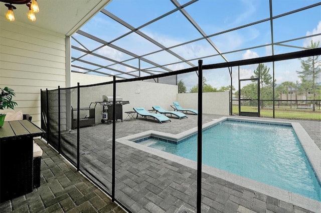 927 Paradise Dr, Davenport, FL 33897 - view of swimming pool featuring a patio, area for grilling, and glass enclosure