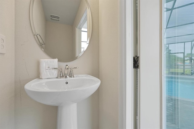 927 Paradise Dr, Davenport, FL 33897 - bathroom with healthy amount of natural light