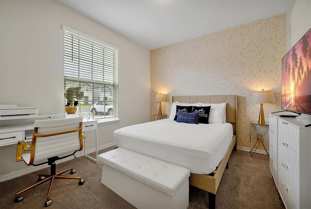 927 Paradise Dr, Davenport, FL 33897 - carpeted bedroom featuring wallpapered walls and an accent wall