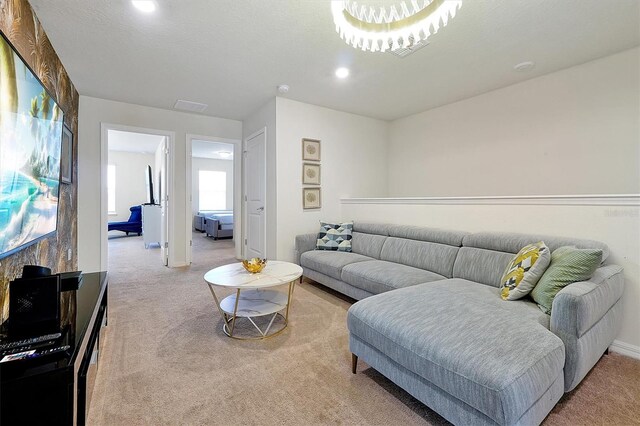 927 Paradise Dr, Davenport, FL 33897 - living room featuring light carpet and recessed lighting