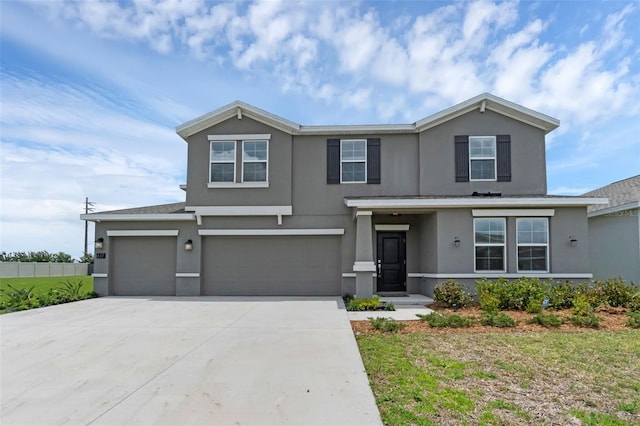 617 Hitch Loop, Saint Cloud, FL 34772 - traditional home with stucco siding, driveway, and a garage