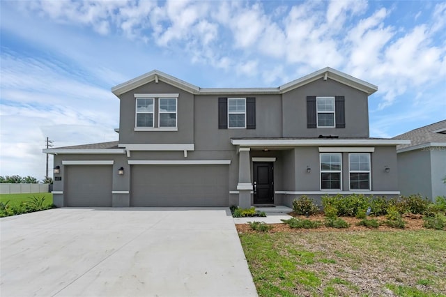 617 Hitch Loop, Saint Cloud, FL 34772 - traditional-style home with stucco siding, driveway, and a garage