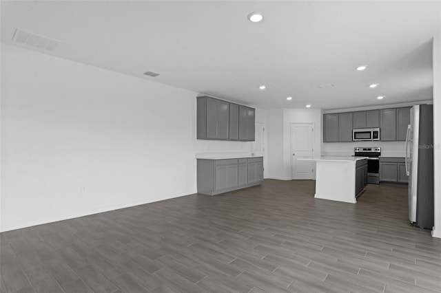617 Hitch Loop, Saint Cloud, FL 34772 - unfurnished living room featuring recessed lighting and wood finished floors