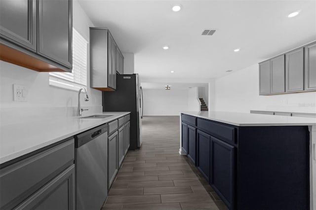 617 Hitch Loop, Saint Cloud, FL 34772 - kitchen featuring appliances with stainless steel finishes, a center island, light countertops, recessed lighting, and dark wood-type flooring