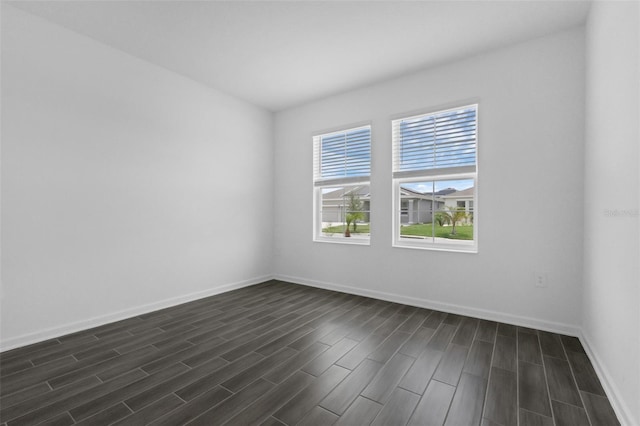 617 Hitch Loop, Saint Cloud, FL 34772 - spare room with dark wood-style flooring and baseboards