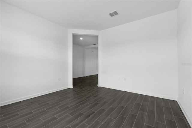 617 Hitch Loop, Saint Cloud, FL 34772 - spare room featuring dark wood-style floors and recessed lighting