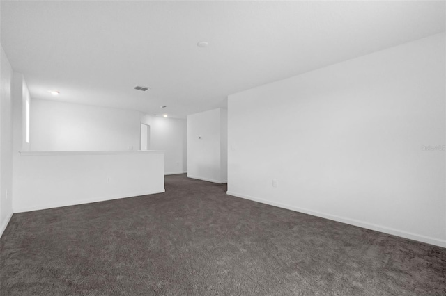 617 Hitch Loop, Saint Cloud, FL 34772 - spare room with dark carpet and baseboards