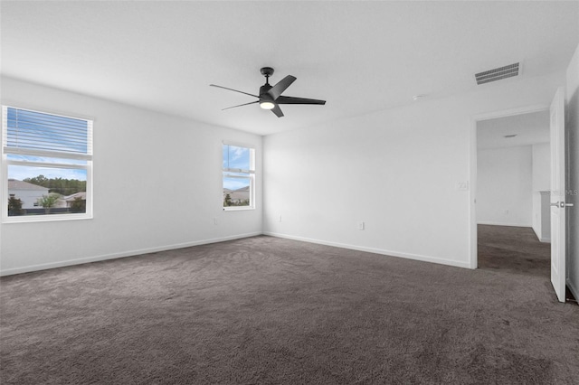 617 Hitch Loop, Saint Cloud, FL 34772 - spare room with dark colored carpet and a ceiling fan