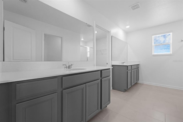 617 Hitch Loop, Saint Cloud, FL 34772 - full bathroom featuring two vanities, tile patterned flooring, and recessed lighting