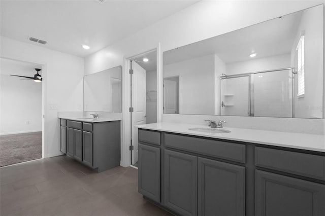 617 Hitch Loop, Saint Cloud, FL 34772 - bathroom featuring a stall shower, two vanities, ceiling fan, recessed lighting, and tile patterned flooring