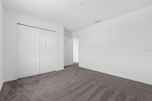 617 Hitch Loop, Saint Cloud, FL 34772 - unfurnished bedroom featuring carpet floors and a closet