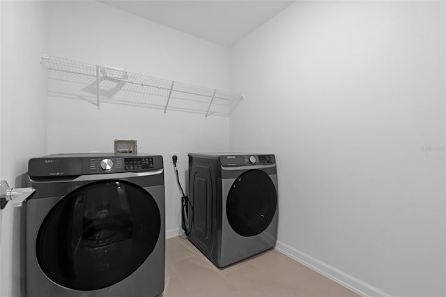 617 Hitch Loop, Saint Cloud, FL 34772 - laundry area featuring independent washer and dryer and baseboards