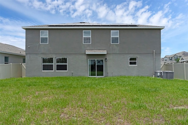617 Hitch Loop, Saint Cloud, FL 34772 - back of property featuring stucco siding and solar panels