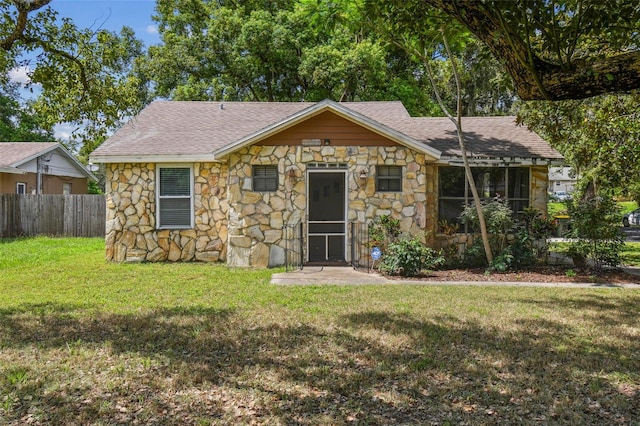 1108 W Minnehaha Ave, Clermont, FL 34711 - view of front facade with stone siding and a shingled roof