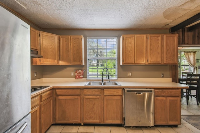 1108 W Minnehaha Ave, Clermont, FL 34711 - kitchen with dishwasher, freestanding refrigerator, light countertops, black electric stovetop, and light tile patterned flooring