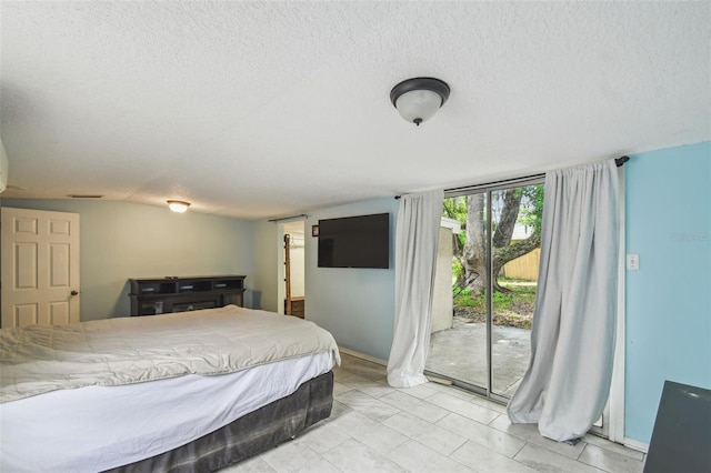 1108 W Minnehaha Ave, Clermont, FL 34711 - bedroom with access to exterior and a textured ceiling