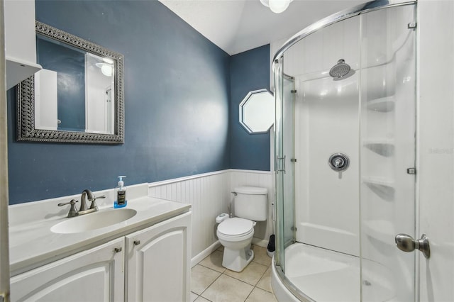 1108 W Minnehaha Ave, Clermont, FL 34711 - full bath featuring a stall shower, tile patterned flooring, wainscoting, and vanity