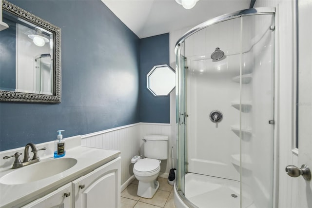 1108 W Minnehaha Ave, Clermont, FL 34711 - bathroom featuring a shower stall, a wainscoted wall, tile patterned flooring, and vanity