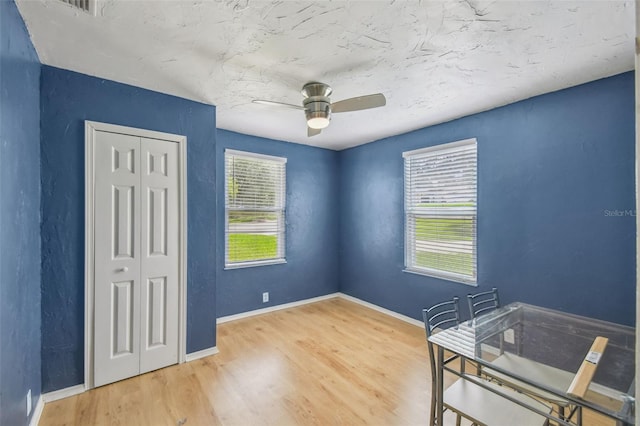 1108 W Minnehaha Ave, Clermont, FL 34711 - unfurnished bedroom featuring a closet, wood finished floors, and a ceiling fan