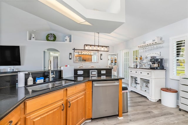 198 Porto Velho St, Punta Gorda, FL 33983 - kitchen with dishwasher, light wood finished floors, arched walkways, brown cabinetry, and a chandelier