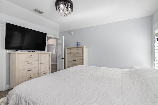 198 Porto Velho St, Punta Gorda, FL 33983 - bedroom with wood finished floors and a chandelier