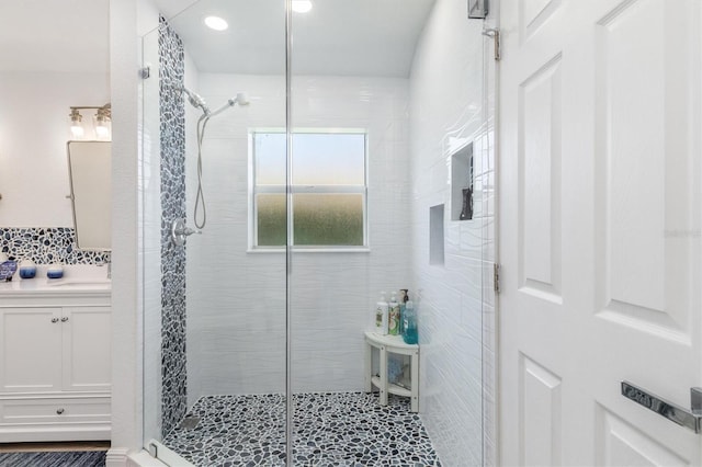 198 Porto Velho St, Punta Gorda, FL 33983 - full bathroom featuring a shower stall, vanity, recessed lighting, and tasteful backsplash